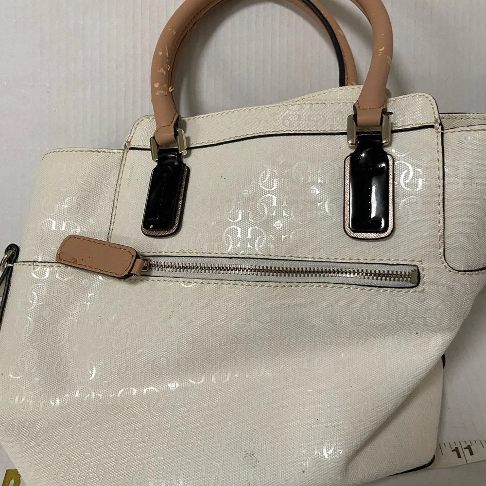Guess purse cream w black flowers useful but well loved $49
